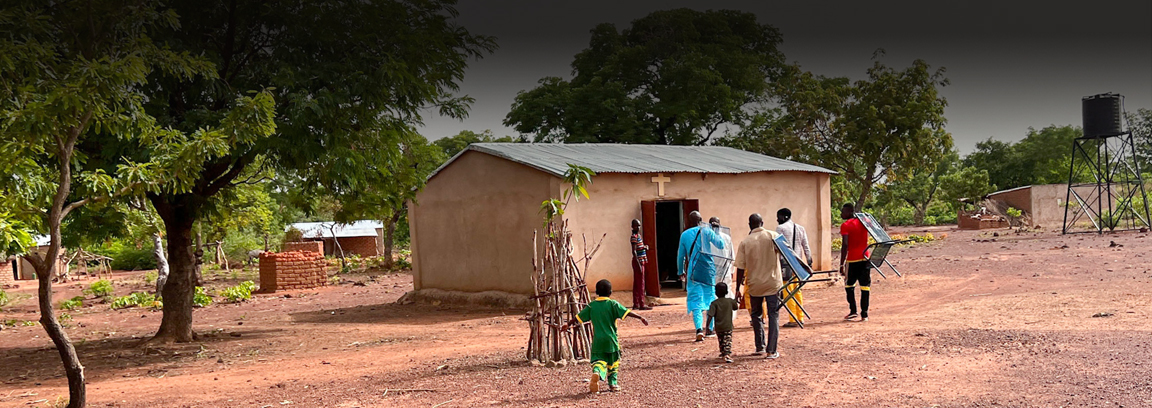People walking to church in West African village